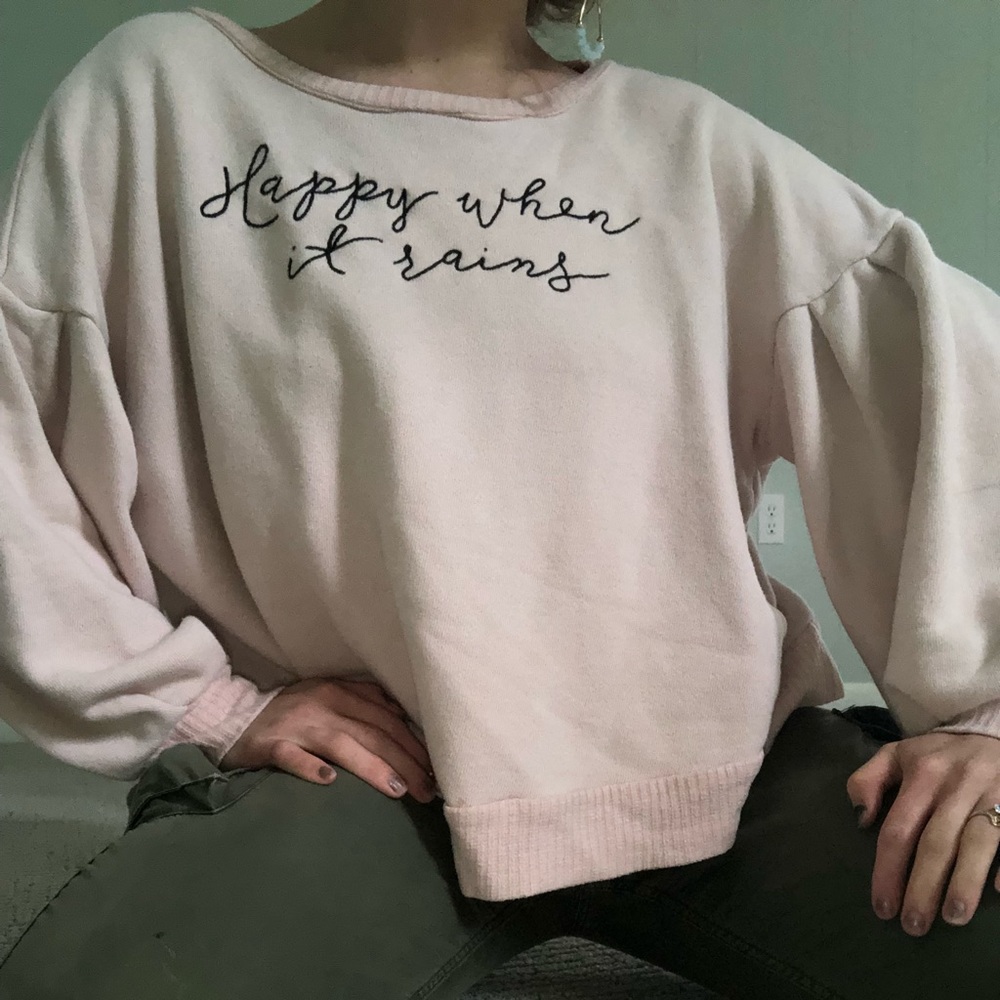 “Happy When It Rains” cropped sweatshirt.